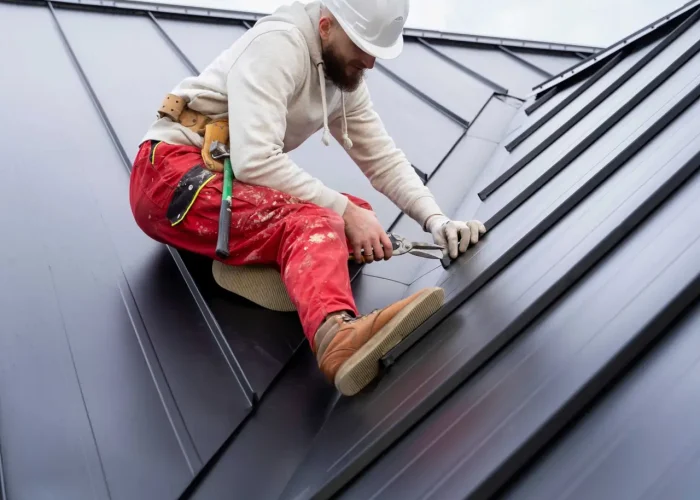 full-shot-man-with-helmet-working-roof (1)